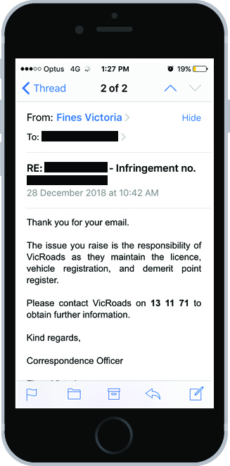 An image of a mobile phone with an email on the screen. The email from Fines Victoria says 